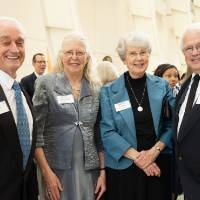 Guests posing in the Grand Gallery before the Enrichment Dinner.